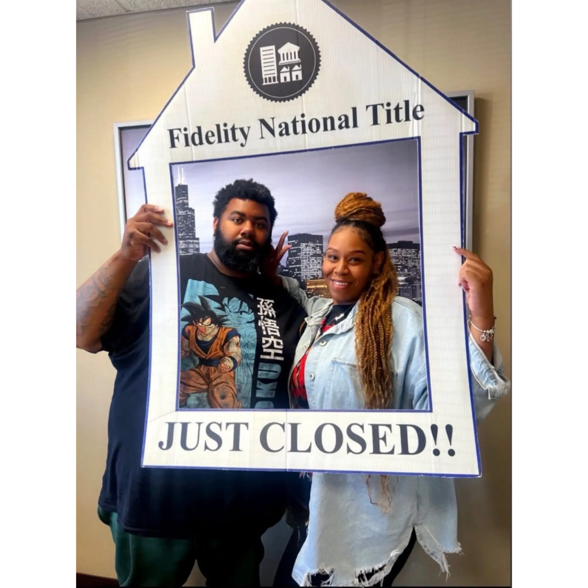 Taja M. celebrating her home closing with a Fidelity National Title frame